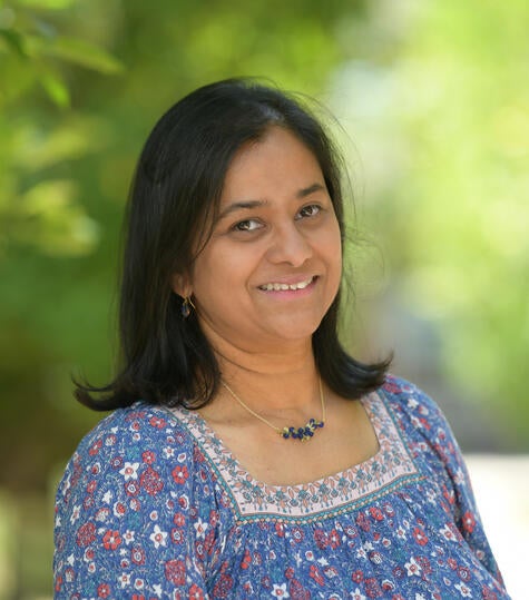 Girl Looking Through Microscope